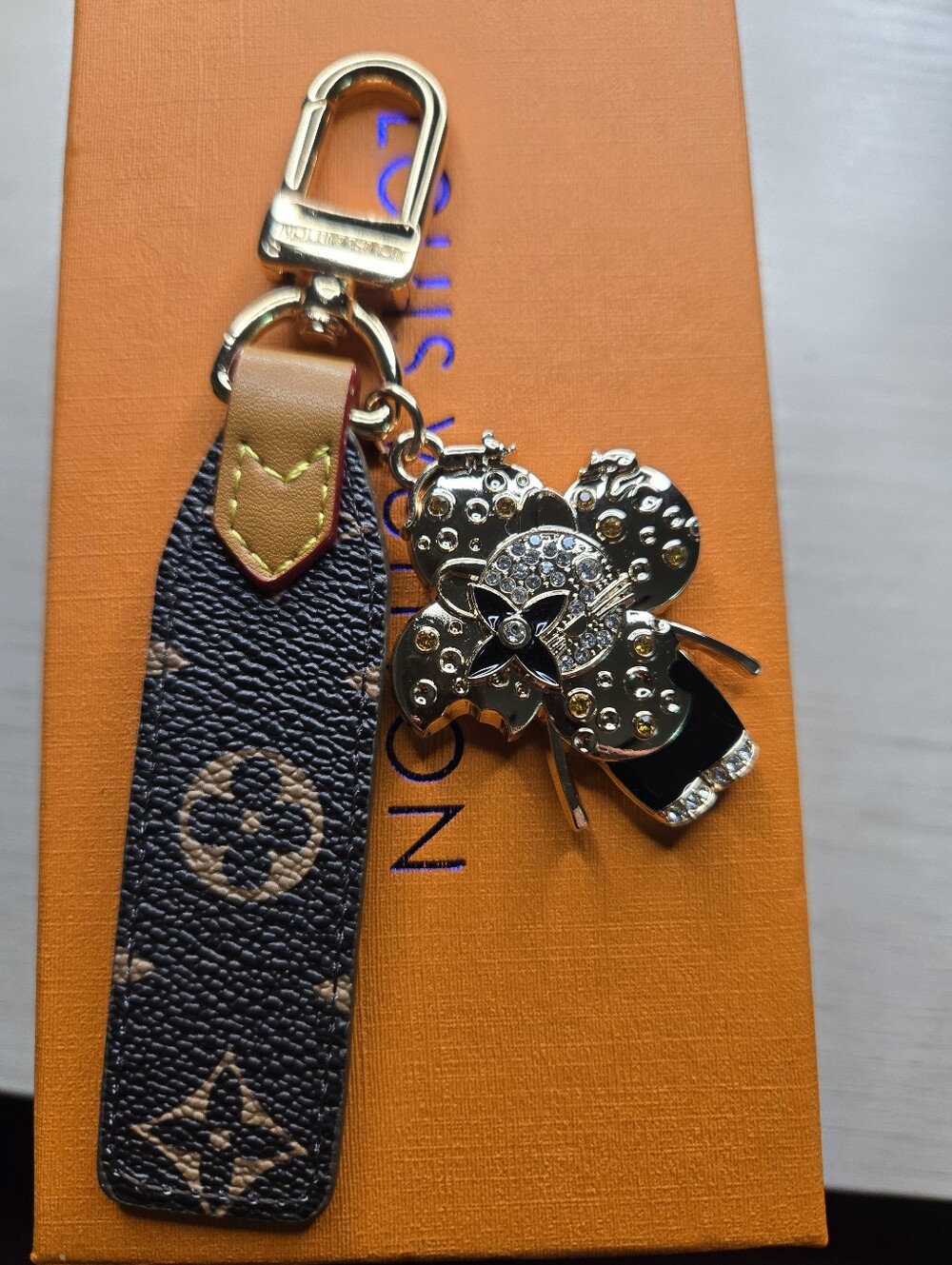 Designer-Inspired Black and Tan Leather Key Charm with Gold Flower Accent